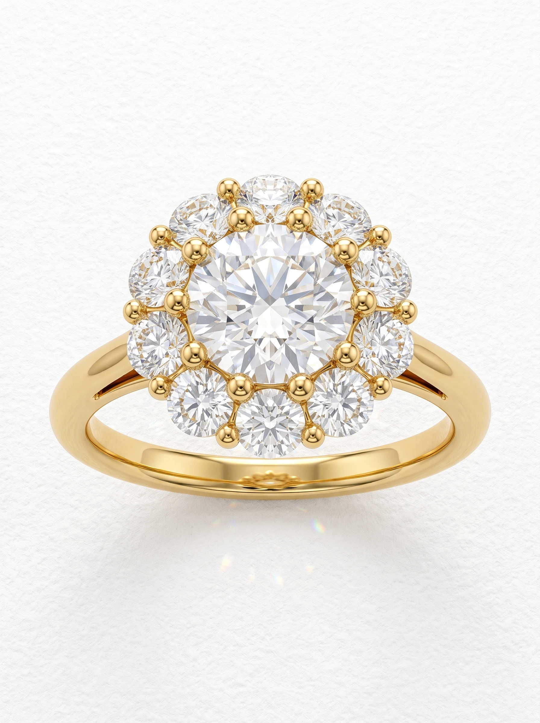Round flower halo engagement ring in yellow gold, front view of ten halo diamonds in bead prongs