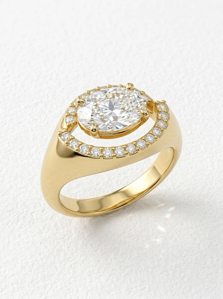 East west oval halo engagement ring in yellow gold, two-part offset pavé halo around the oval center