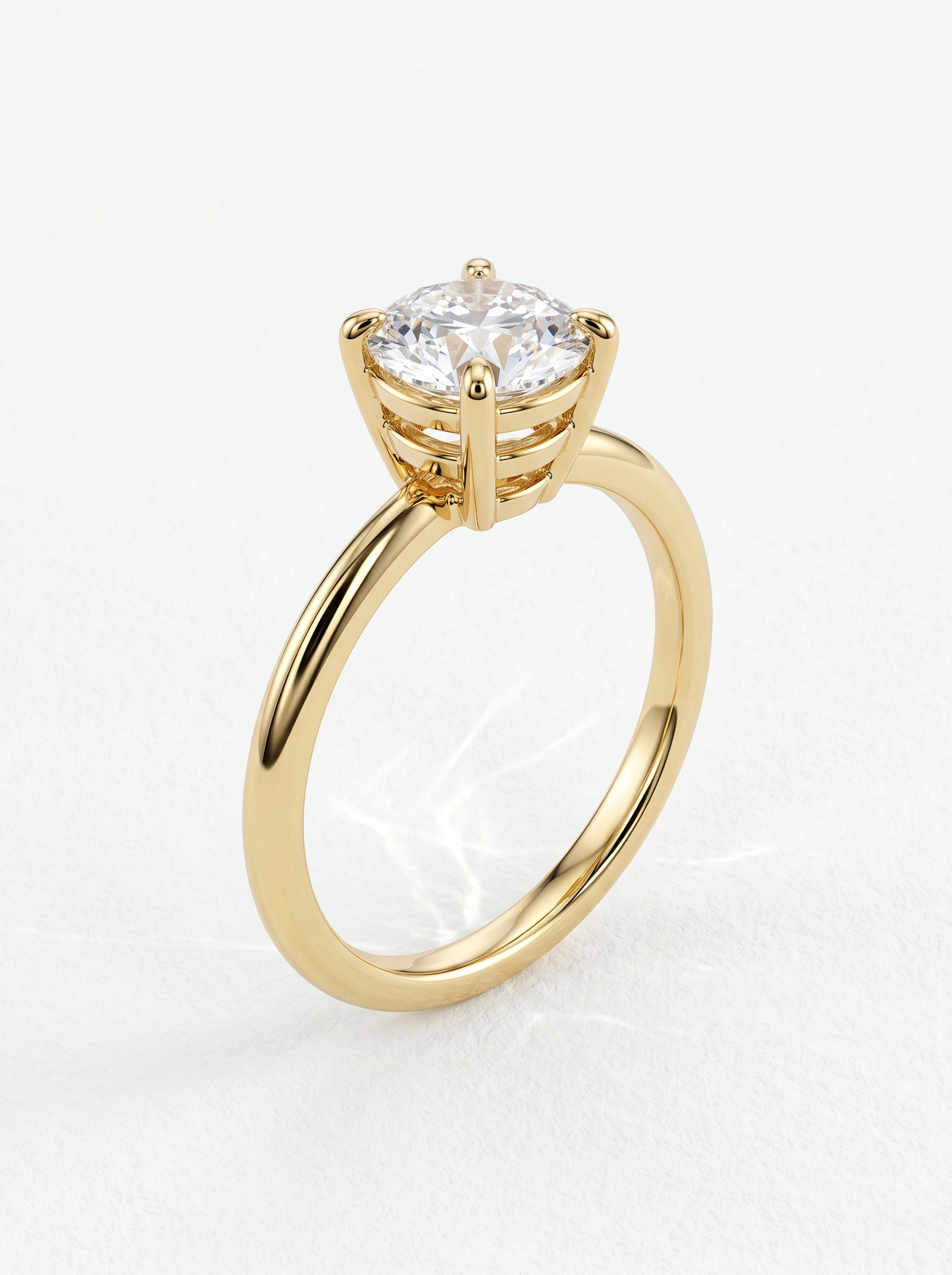 Round triple rail basket engagement ring in yellow gold standing upright, four claw prongs on a high-set head