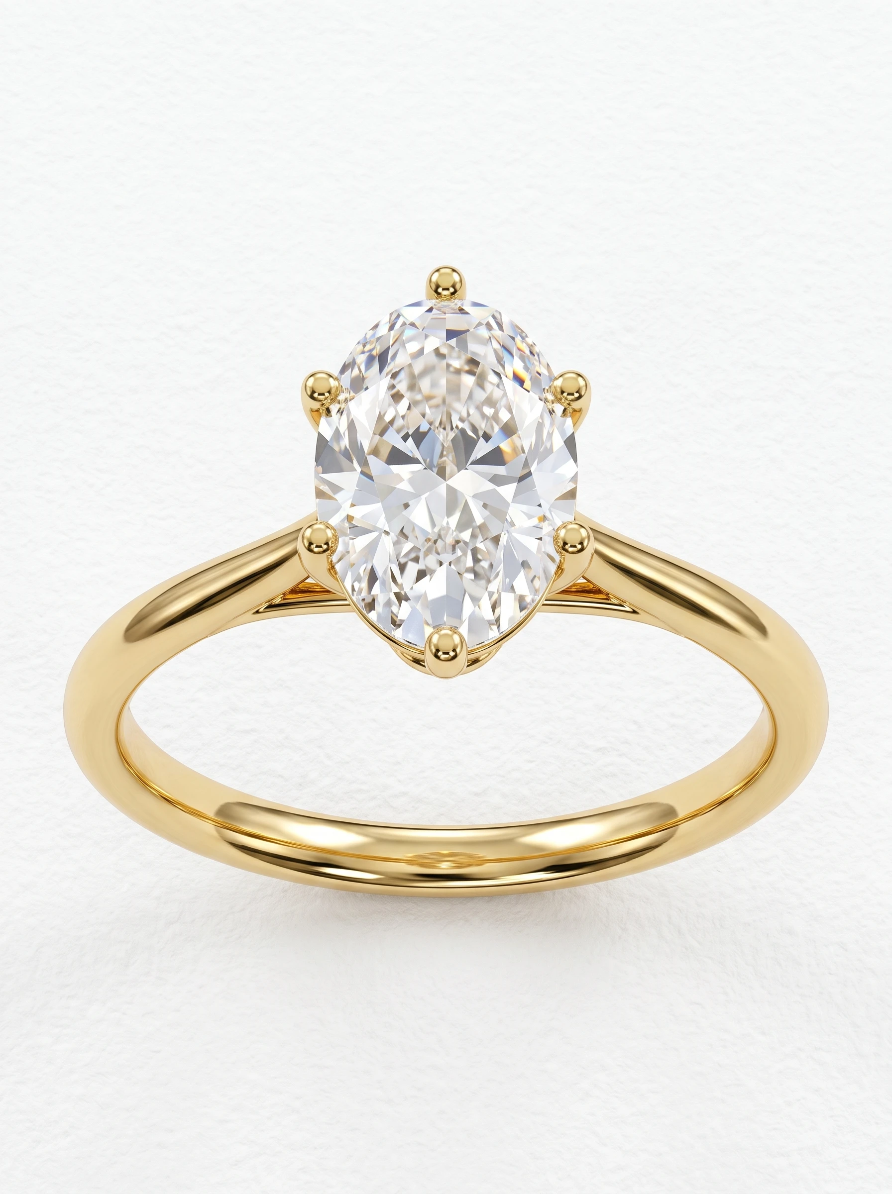 Oval six prong basket engagement ring in yellow gold, front view of the oval center and polished band