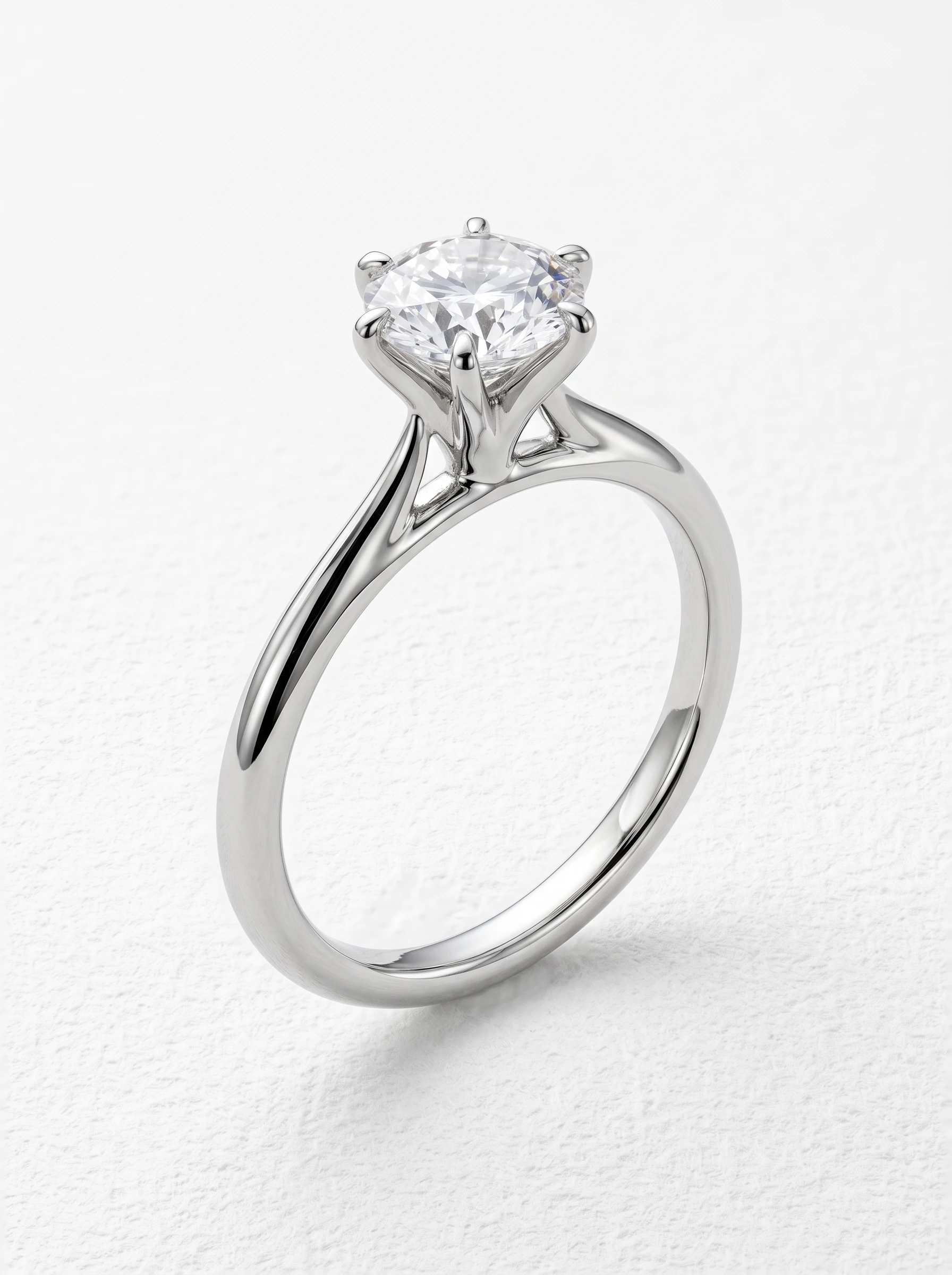 Round six prong solitaire engagement ring in platinum standing upright, eagle claw prongs and cathedral shoulders