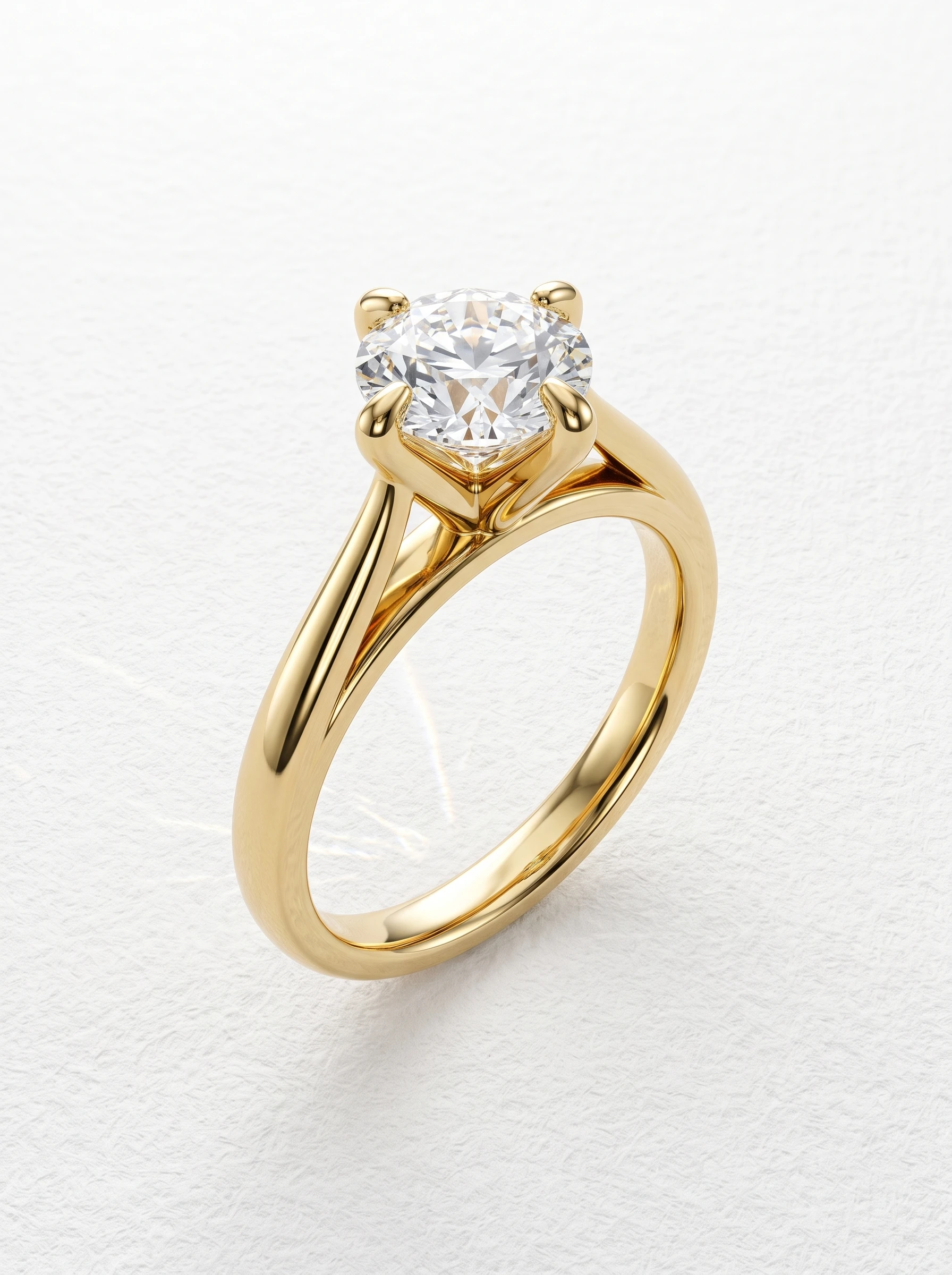 Round compass prong engagement ring in yellow gold standing upright, four N-E-S-W claws on cathedral shoulders