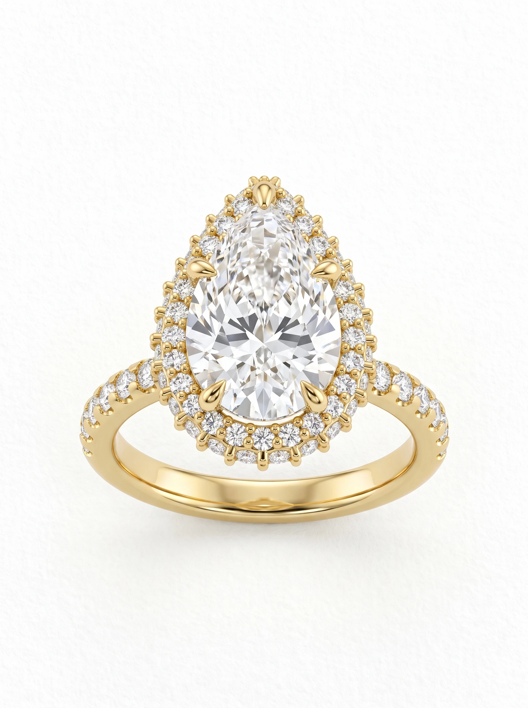 Pear double halo engagement ring in yellow gold, front view with five claw prongs and a pave diamond band